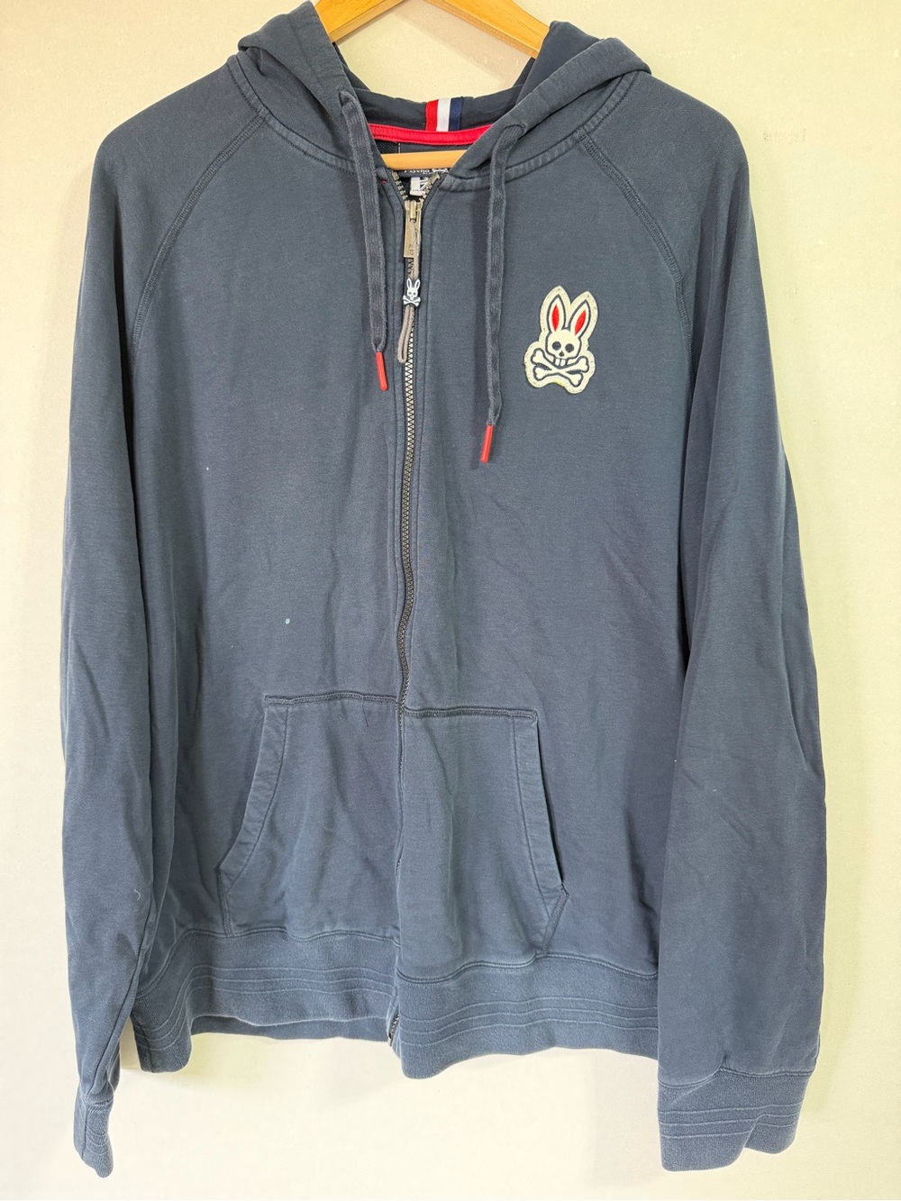 Psycho Bunny Navy Zip Hoodie with Bunny Skull Patch and Red Drawstring Tips